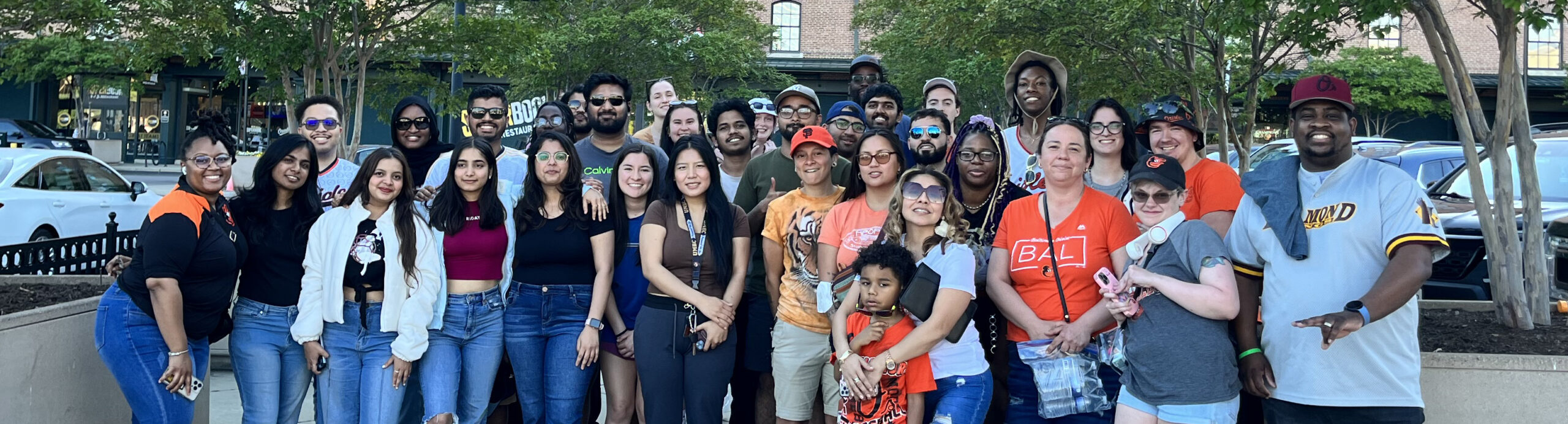 Group of students and staff in front of Oriole Park at Camden Yards.